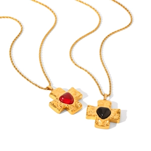 Golden twist chain necklace with hammered cross pendant and heart-shaped glass stones