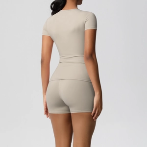 Back view of a nude high-elasticity fitness set featuring a slim-fit top and sports shorts