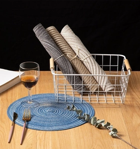 Macro shot of colorful woven round and rectangular heat resistant cotton place mats