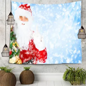 Detail of Christmas tapestry with Santa Claus and winter scene hanging on a gray wall