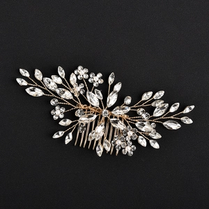 Close-up of bridal hair comb with marquise crystals and pearls on gold wire floral design