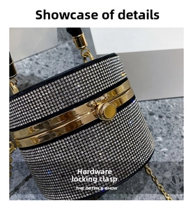 Close-up of the elegant rhinestone bucket bag featuring a secure gold metal lock closure