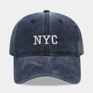 Vintage navy blue washed cotton baseball cap with white NYC letter embroidery on front