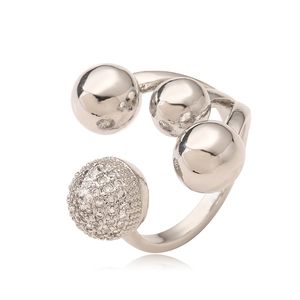 Detail of irregular geometric open ring with silver spheres and sparkling zircon inlay