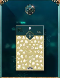 Detail of white translucent mountain texture nail stickers on luxury green packaging