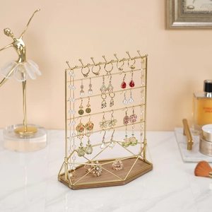 Golden iron jewelry display stand with four tiers and solid wood base for necklaces