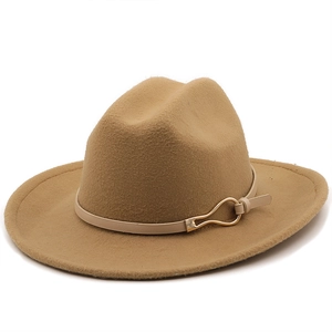 Detail of camel wool fedora hat featuring a slim leather band and golden metal buckle