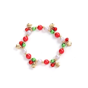 Detail of Christmas bracelet with red and green beads, golden stars and red bells