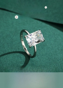 Macro shot of rectangular cut cubic zirconia set in silver-tone four-prong mounting