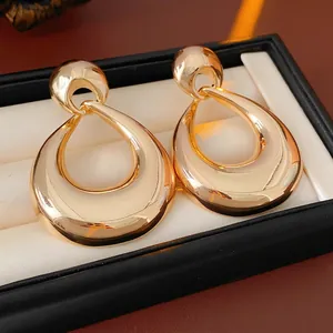 Vintage oversized hollow waterdrop earrings in polished gold metal for women
