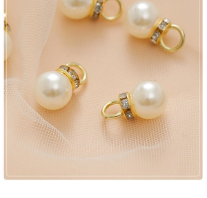 Macro shot of faux pearl pendant with gold alloy base for DIY jewelry making