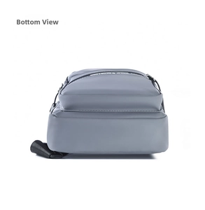 Detailed view of the wide sturdy bottom and grey waterproof nylon fabric of the chest bag