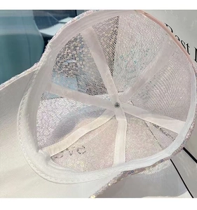 Detail showing the breathable white mesh lining and reinforced sweatband of the sequin cap