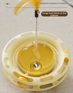 Detail view of the weighted balance base and internal structure of this cat tumbler toy