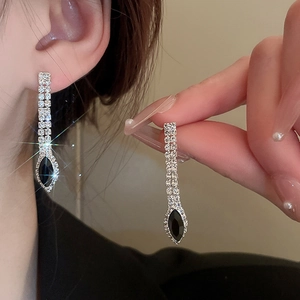 Elegant silver tassel earrings with sparkling rhinestones and black marquise gemstones