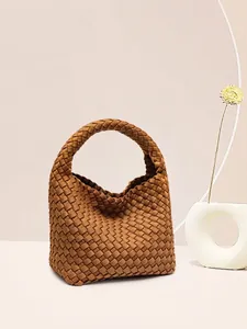 Classic brown woven leather bucket bag with top handle and spacious crescent silhouette