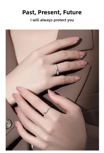 Detail of Cupid Feather silver couple rings with twisted rope and leaf design on model