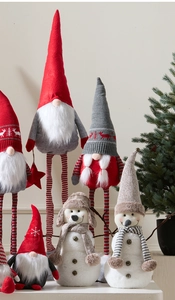 Close-up of festive Christmas gnomes and snowmen with knitted hats and plush textures
