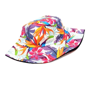 Detail of vibrant tropical floral print on wide-brim bucket hat with stitching