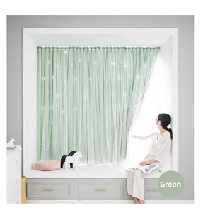 Detail of green blackout curtains with sheer layer and star lights on a bedroom window