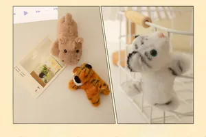 Simpatici peluche magnetici di animali attaccati a superfici metalliche tigre e ippopotamo