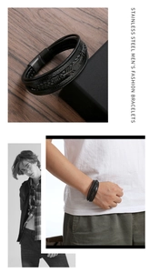 Detail view of multi-layer black braided leather men's bracelet with leaf pattern and magnet clasp
