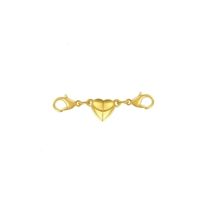 Macro shot of gold heart-shaped magnetic clasp with lobster claws for jewelry DIY