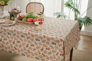 Detail of Christmas gingerbread man and tree patterns on cotton linen tablecloth