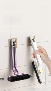 Crevice cleaning brush with wall-mounted hanging hole for space-saving bathroom storage