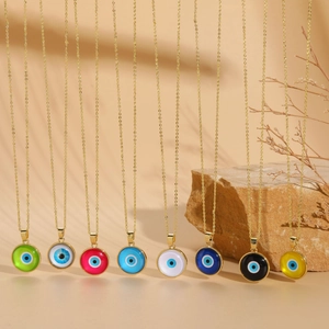 Detail showing eight colors of evil eye resin pendants with gold-plated link chains