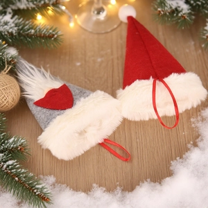 Nordic Christmas gnome cutlery holders with red and grey felt hats for festive table decor
