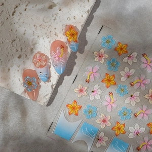 3D floral nail art stickers featuring pink and blue tropical flowers with embossed texture