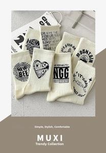 Detail of cream cotton socks with street style prints including heart and letter motifs