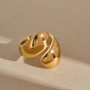 Polished gold double petal bypass ring in a minimalist stainless steel bold design