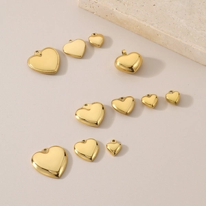 Polished heart-shaped gold pendants in various sizes for DIY jewelry making