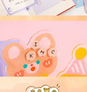 Close-up of cute orange acrylic bear clip and alphabet stickers for DIY journal decor