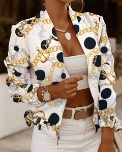 Detail of silver metal zipper and chain print on white long-sleeve jacket for women