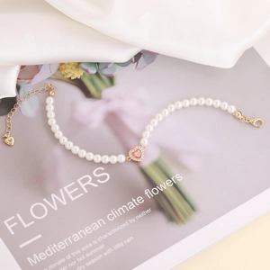 Elegant 18K gold plated pearl bracelet with a sparkling pink zircon heart pendant