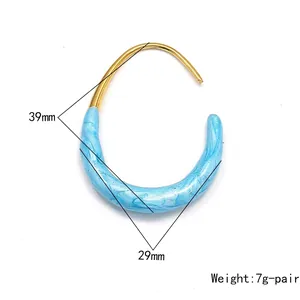 U-shaped earrings with gold plating and blue marble enamel measuring 39mm by 29mm