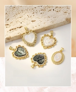 Macro shot of gold-plated shell pendants with religious relief and zircon stones