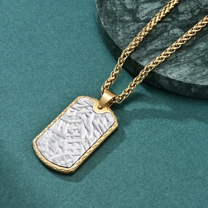 Golden rectangle pendant with silver hammered texture on a stylish woven chain