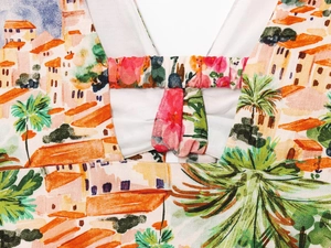 Detail of vibrant Mediterranean print and high-quality fabric texture on the midi skirt