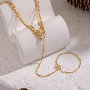 Bohemian gold stainless steel slave bracelet with sparkling round white zircons