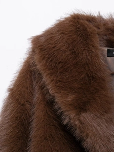 Macro detail of high-quality dark brown faux fox fur collar with rich texture and fibers