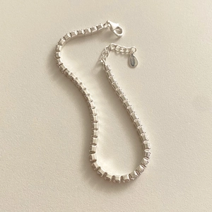 Detail of silver 925 tennis bracelet with round cubic zirconia and lobster clasp