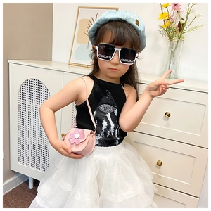 Close-up of pink flower crossbody bag and white square sunglasses for toddler girls
