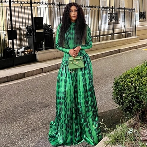 Detailed close-up of high-neck long sleeve maxi dress with green printed satin fabric