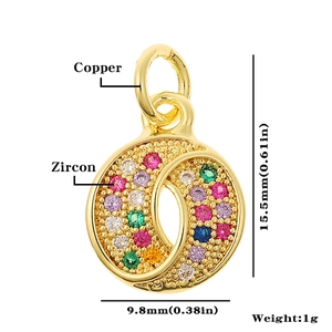 Macro view of gold copper pendant with colorful zircon stones and dimension markers