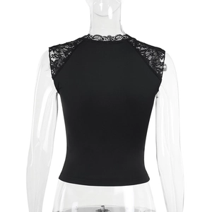 Close-up of floral lace patchwork detail on the back of a black cropped tank top