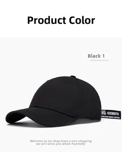 Detail of black cotton baseball cap featuring long street-style decorative lettered strap